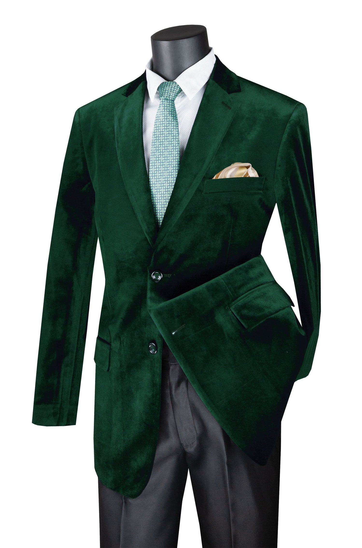 Green velvet suit jacket on a mannequin with a white shirt and green tie.
